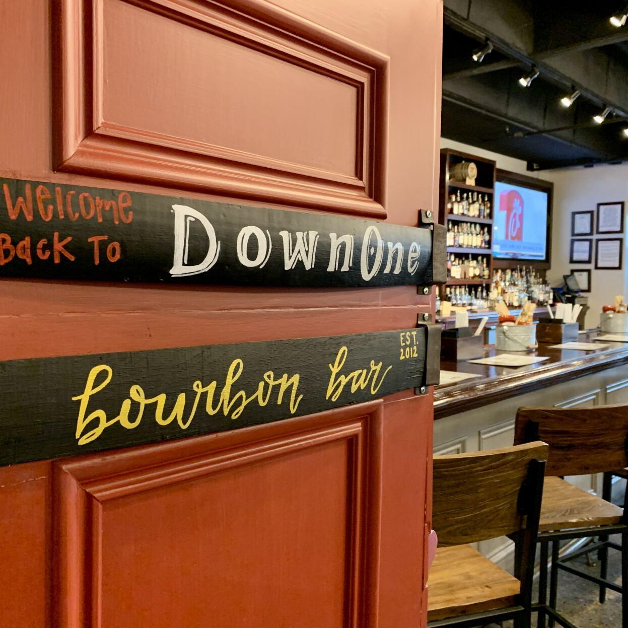 Down One Bourbon Bar sign on door